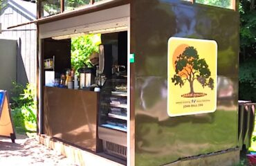 A custom-designed portable kiosk designed for outdoor vending at a zoo. Shown with the doors open.