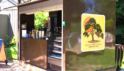 A custom-designed portable kiosk designed for outdoor vending at a zoo. Shown with the doors open.