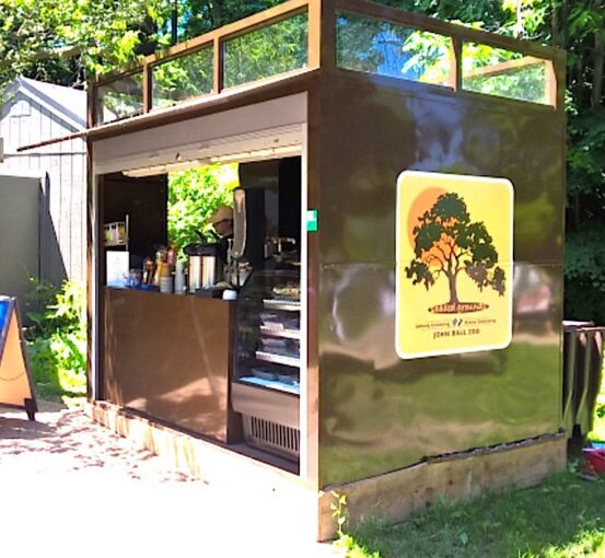 A custom-designed portable kiosk designed for outdoor vending at a zoo. Shown with the doors open.