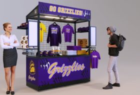 A very attractive mobile vending kiosk wrapped in custom vinyl university-themed graphics with the optional LED lighting installed.