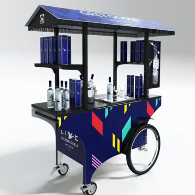 A custom push cart designed for selling Grey Goose vodka, but well suited for the promotion of any alcoholic beverage.