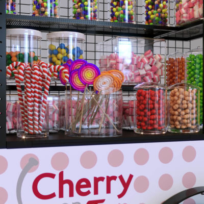 A closeup view of a push cart configured for selling candy