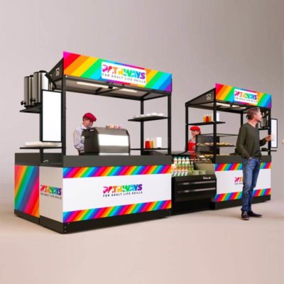 A very colorful concession stand shown with a display fridge, espresso maker, menu boards and LED ligthing.