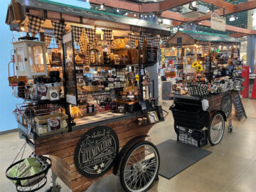 A push cart for street vending, wrapped in a wood-grain vinyl wrap, designed for selling retail merchandise