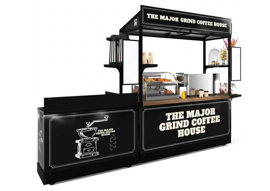 A dark, modern espresso kiosk package with a commercial sink, espresso machine and pastry displays