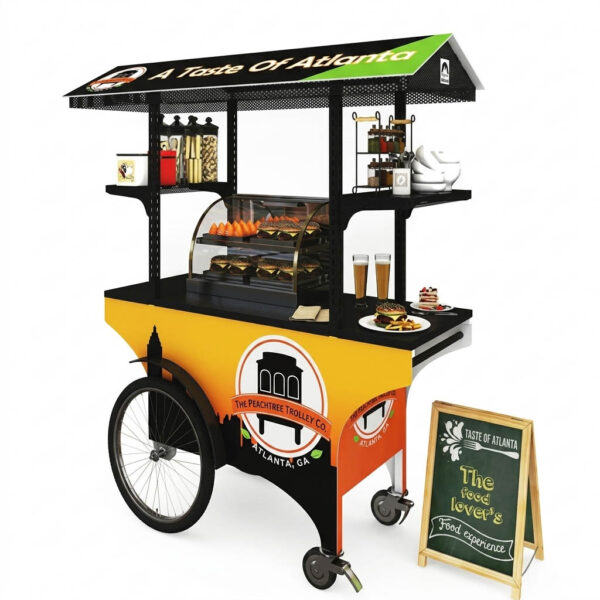 Commercial food push cart with yellow branding, overhead canopy, and a sidewalk menu chalkboar