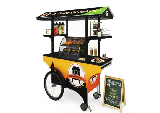 Commercial food push cart with yellow branding, overhead canopy, and a sidewalk menu chalkboar