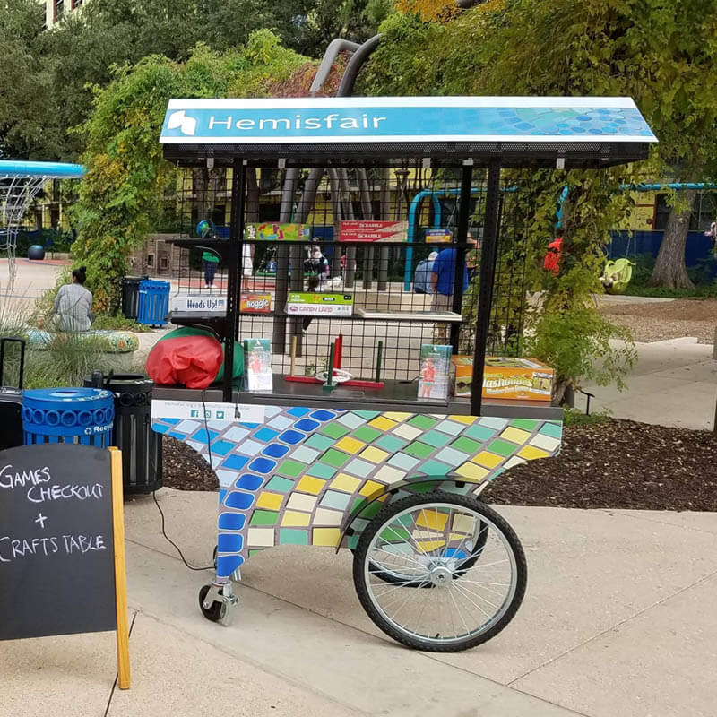 A multicolor cart in cool colors for a games station